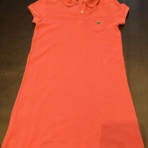 Lacoste Pink Dress, size 10 in kids. Has buttons and is a short sleeve.